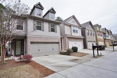 Multi unit property featuring driveway, brick sidi