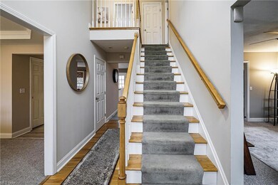 Two story entry with hardwood flooring
