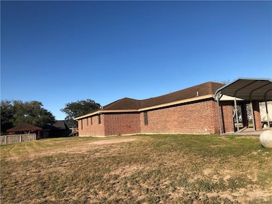 View of home's exterior featuring a patio area and brick siding