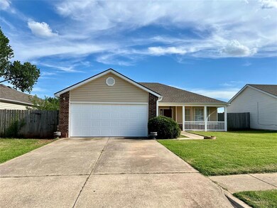 Ranch-style home with a garage and a front yard