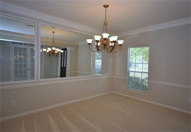 Formal dining room, crown molding, and 2 inch faux