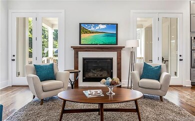 Living room with double doors to covered back porc