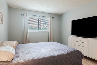 Bedroom featuring light hardwood / wood-style floo