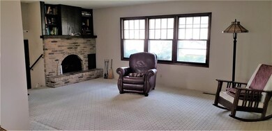Living room with gas start wood burning fireplace