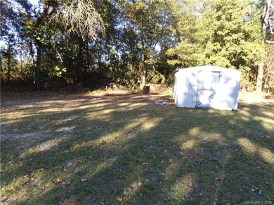 Spacious back yard with storage