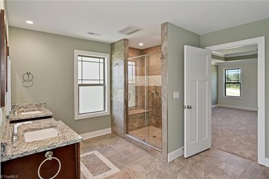 Beautiful Master Bathroom with granite countertops and high end tile work