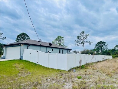 View of side of home featuring stucco siding and roof with shingles