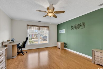 Office space with a textured ceiling, ornamental m