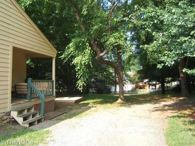 Patio/Deck. Covered Side Porch Leads to Kitchen. Enjoy Circle Driveway and Large, Fenced, Wooded Backyard on Corner Lot!