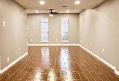Tile flooring and recessed LED lighting throughout