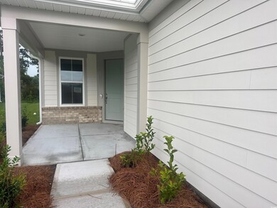 Property entrance featuring covered porch