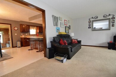 Open to dining and kitchen.