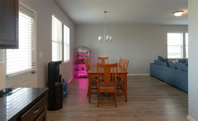 Dining space featuring a chandelier, light wood f