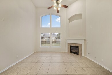 The living room with tall, gorgeous windows that h