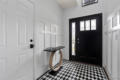 Foyer entrance featuring tile patterned floors