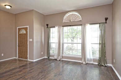 Entryway featuring dark wood finished floors and 