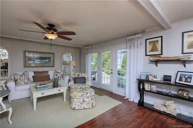 Great room opens to the well appointed and updated kitchen and French doors lead to the covered deck.