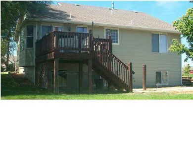 Back of home with deck