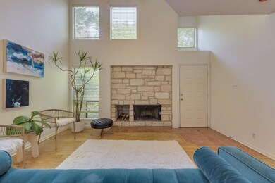 Living area with a high ceiling, baseboards, and 