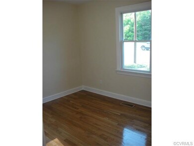 Bedroom in the front...Notice the hardwood floors.