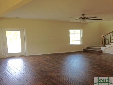 Very Open Family Room with Laminate Wood Floors