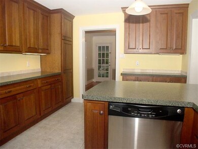 Custom Cherry cabinets and ceramic tile floor
