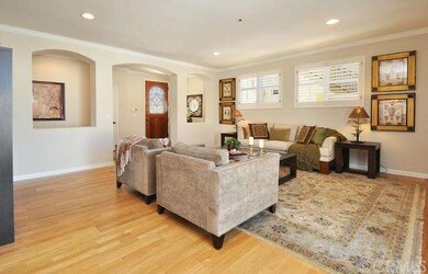 Gleaming hardwood floors, Spanish-style arches, pl