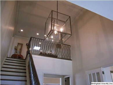 Custom Chandelier and Handrail in Foyer