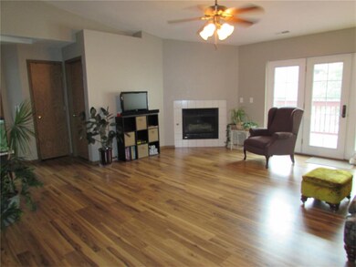 Spacious vaulted great room with gas fireplace.
