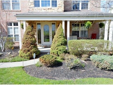 This beautiful upgraded front porch welcomes your 