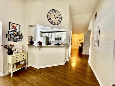 Kitchen featuring stainless steel appliances, ston