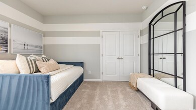 Bedroom with a closet and carpet flooring