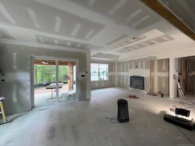 View from kitchen to dining room, doors to screened porch, living room with gas log fireplace