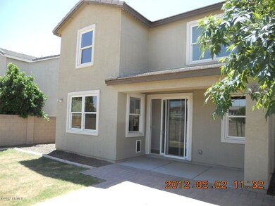 REAR OF HOME/COVERED PATIO