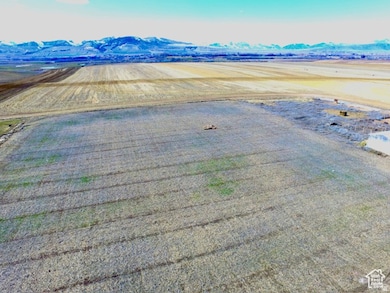 View of rural area featuring mountains and abundant farmland