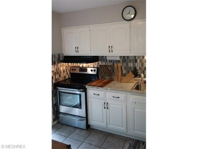 Kitchen has been updated with ceramic flooring, st