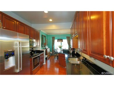 Sophisticated kitchen with granite, glass subway t