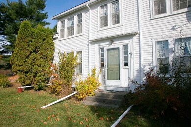 Center entrance colonial with wood...