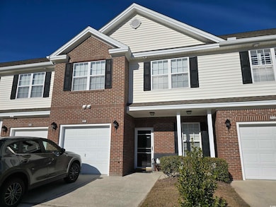 View of property featuring a garage