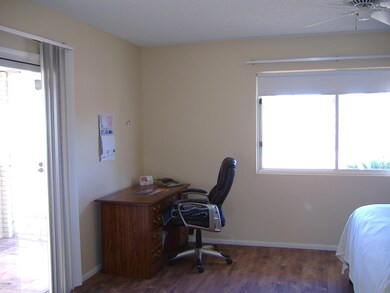 MASTER BEDROOM WITH DOOR TO FRONT PATIO