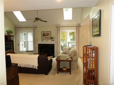 Family room with gas fireplace and sky lights