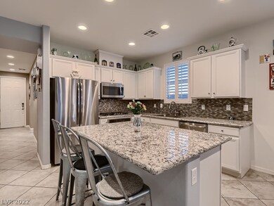 FRONT DOOR ENTRY VIEW AND OPEN KITCHEN WITH STAINL