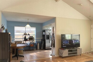 Kitchen featuring stainless steel fridge, light w