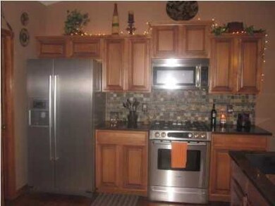 Gas stove and refrigerator stay with this home