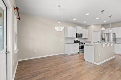 Kitchen featuring light wood finished floors, visi