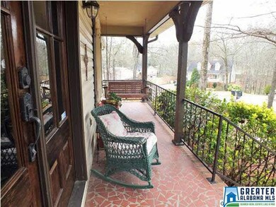 The front entry has French doors and a covered fro