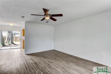 LIVING ROOM WITH NEW LVP FLOORING