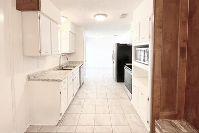 View of kitchen looking towards the breakfast room.