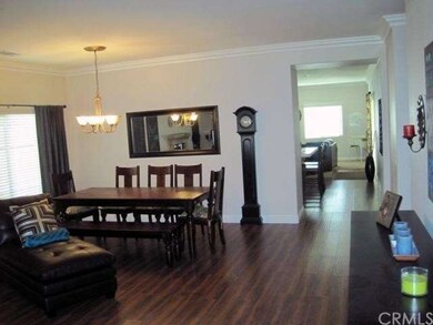 Living room facing kitchen entrance