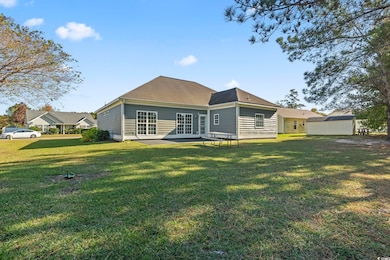 Back of house featuring a lawn